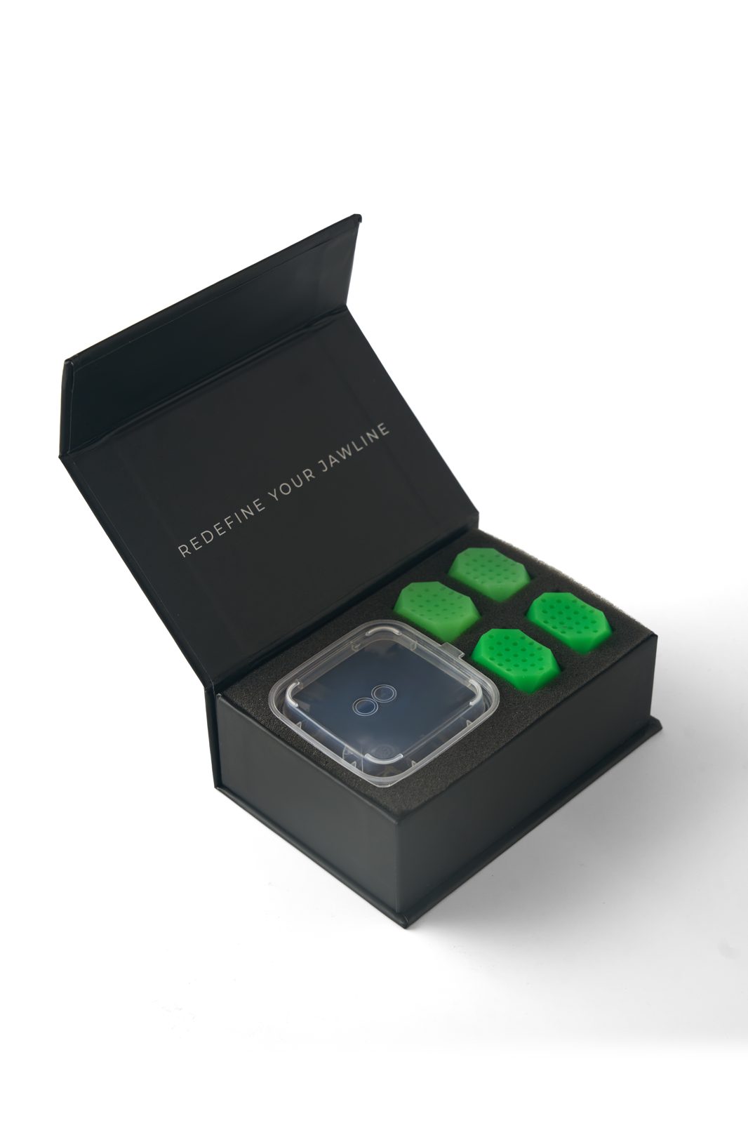 JAWZ box open showing the green jawline exercisers